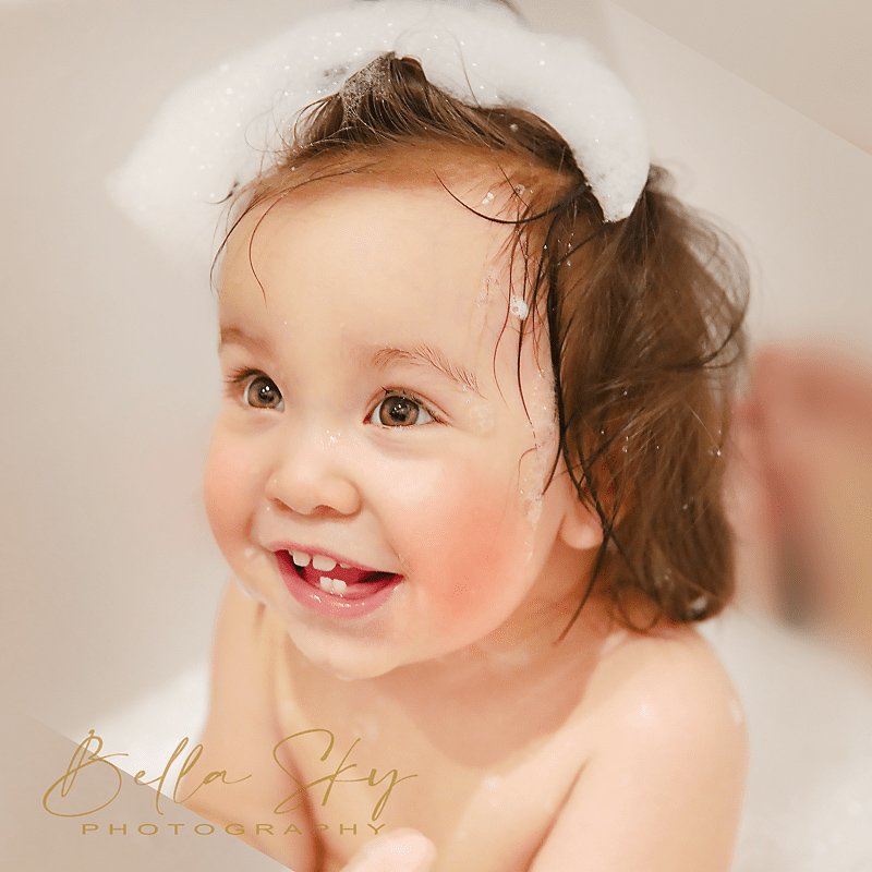 baby taking a bubble bath
