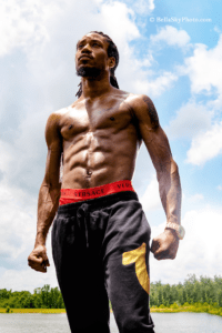 black male fitness portrait by the lake